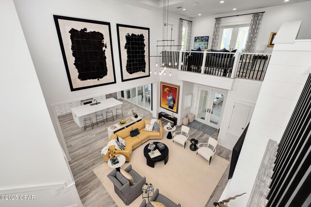 135 Buddy St, Santa Rosa Beach, FL 32459 - living room with french doors, wood finished floors, and recessed lighting