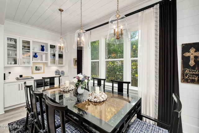 135 Buddy St, Santa Rosa Beach, FL 32459 - dining space featuring light wood finished floors, wooden ceiling, and ornamental molding