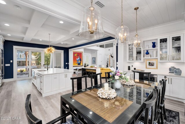 135 Buddy St, Santa Rosa Beach, FL 32459 - dining space featuring light wood-type flooring, coffered ceiling, beamed ceiling, recessed lighting, and baseboards
