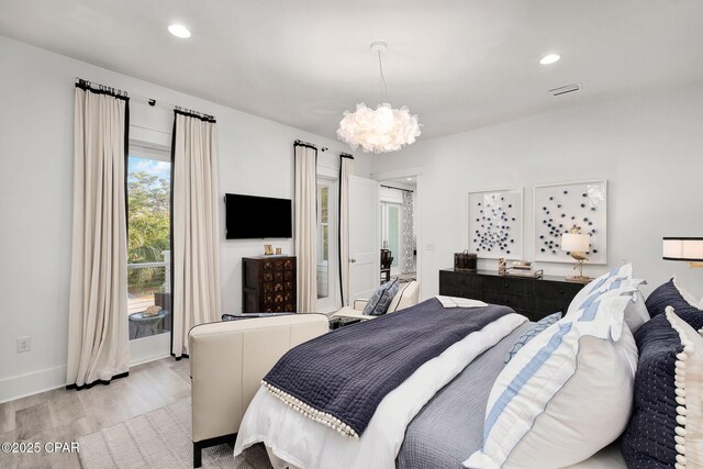 135 Buddy St, Santa Rosa Beach, FL 32459 - bedroom featuring a chandelier, light wood finished floors, recessed lighting, and baseboards