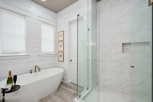135 Buddy St, Santa Rosa Beach, FL 32459 - full bathroom featuring a shower stall, wood finished floors, and a freestanding bath