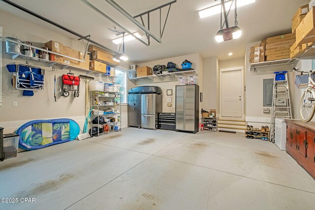 135 Buddy St, Santa Rosa Beach, FL 32459 - garage featuring a garage door opener and electric panel