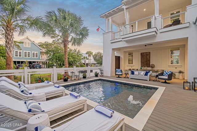 135 Buddy St, Santa Rosa Beach, FL 32459 - pool at dusk featuring an outdoor hangout area