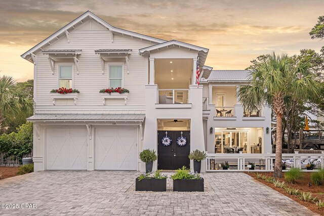 135 Buddy St, Santa Rosa Beach, FL 32459 - view of front of house with a balcony, driveway, and a garage