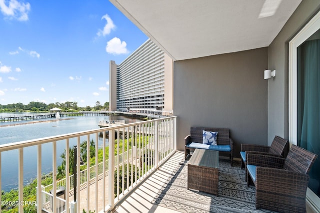 9902 S Thomas Dr Unit 135, Panama City Beach, FL 32408 - balcony with a water view and an outdoor living space