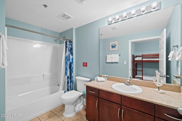 9902 S Thomas Dr Unit 135, Panama City Beach, FL 32408 - full bath with toilet, tile patterned floors, vanity, and shower / tub combo with curtain