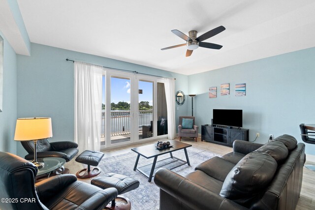 9902 S Thomas Dr Unit 135, Panama City Beach, FL 32408 - living area with light wood finished floors and a ceiling fan