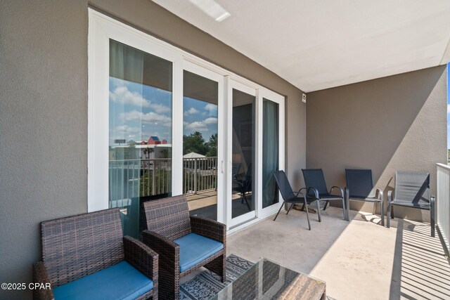 9902 S Thomas Dr Unit 135, Panama City Beach, FL 32408 - view of patio / terrace featuring a balcony