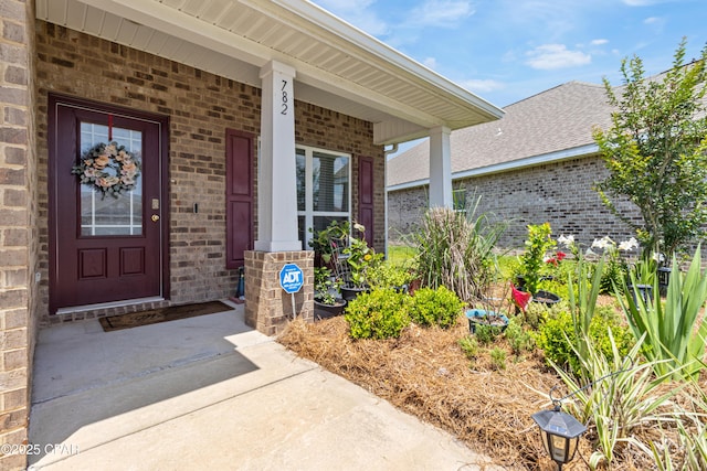 782 Cason Cir, Panama City, FL 32405 - doorway to property featuring brick siding and covered porch