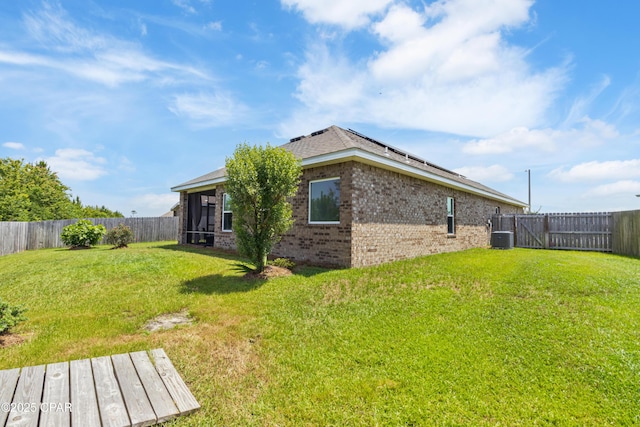 782 Cason Cir, Panama City, FL 32405 - rear view of house featuring brick siding, roof mounted solar panels, and central AC unit