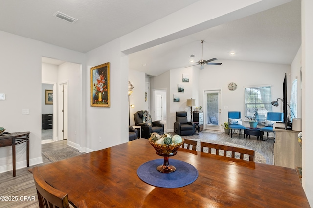 782 Cason Cir, Panama City, FL 32405 - dining area featuring ceiling fan, wood finished floors, baseboards, and vaulted ceiling