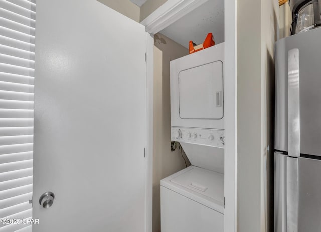 11619 Front Beach Rd Unit 1110, Panama City Beach, FL 32407 - washroom featuring stacked washer / dryer