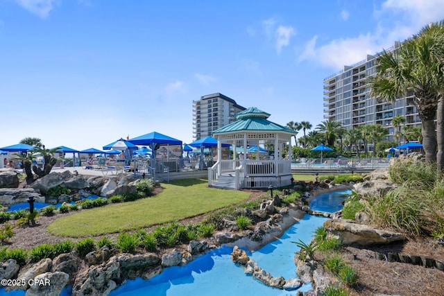 11619 Front Beach Rd Unit 1110, Panama City Beach, FL 32407 - view of property's community with a gazebo and a yard