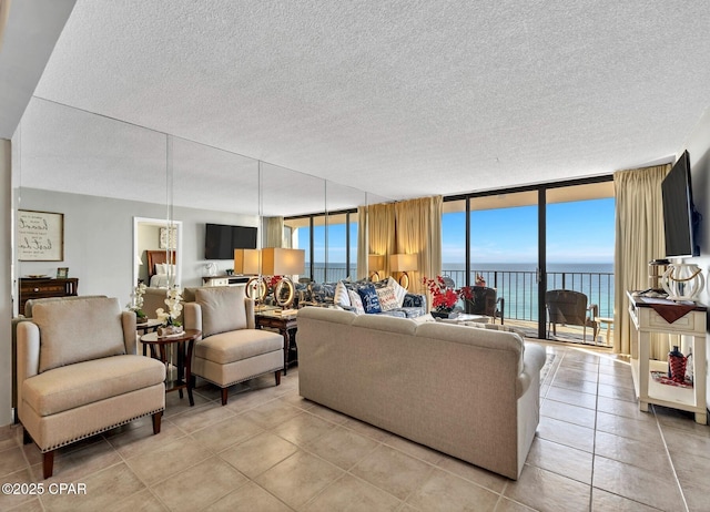 11619 Front Beach Rd Unit 1110, Panama City Beach, FL 32407 - living area with light tile patterned flooring, plenty of natural light, floor to ceiling windows, and a textured ceiling