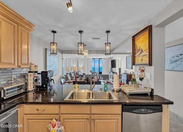 11619 Front Beach Rd Unit 1110, Panama City Beach, FL 32407 - kitchen featuring dishwasher, a sink, pendant lighting, and backsplash