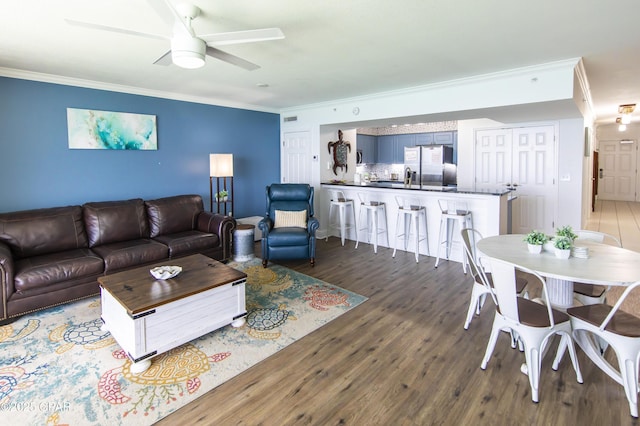 14701 Front Beach Rd Unit 1727, Panama City Beach, FL 32413 - living area with crown molding, wood finished floors, and ceiling fan