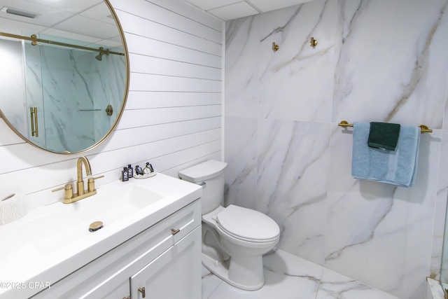 14701 Front Beach Rd Unit 1727, Panama City Beach, FL 32413 - bathroom featuring a marble finish shower, toilet, vanity, wooden walls, and marble finish floors