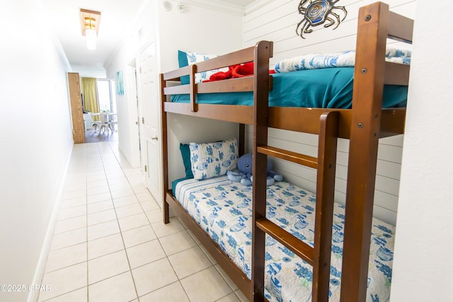 14701 Front Beach Rd Unit 1727, Panama City Beach, FL 32413 - bedroom featuring crown molding, tile patterned floors, and baseboards