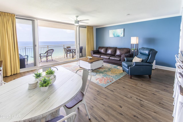 14701 Front Beach Rd Unit 1727, Panama City Beach, FL 32413 - living area featuring a ceiling fan, crown molding, baseboards, wood finished floors, and a water view