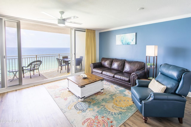 14701 Front Beach Rd Unit 1727, Panama City Beach, FL 32413 - living room featuring wood finished floors, ceiling fan, crown molding, a water view, and expansive windows