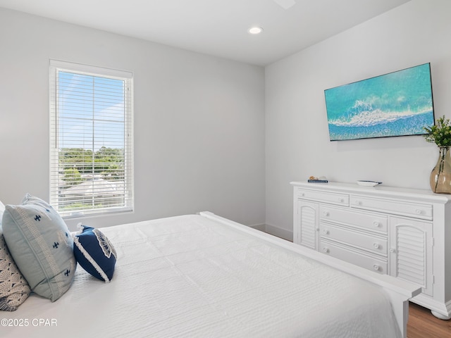 101 Deluna Pl Unit C, Panama City Beach, FL 32413 - bedroom featuring multiple windows, recessed lighting, baseboards, and wood finished floors