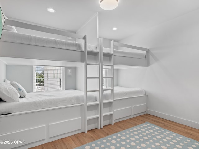 101 Deluna Pl Unit C, Panama City Beach, FL 32413 - bedroom with recessed lighting, wood finished floors, and baseboards