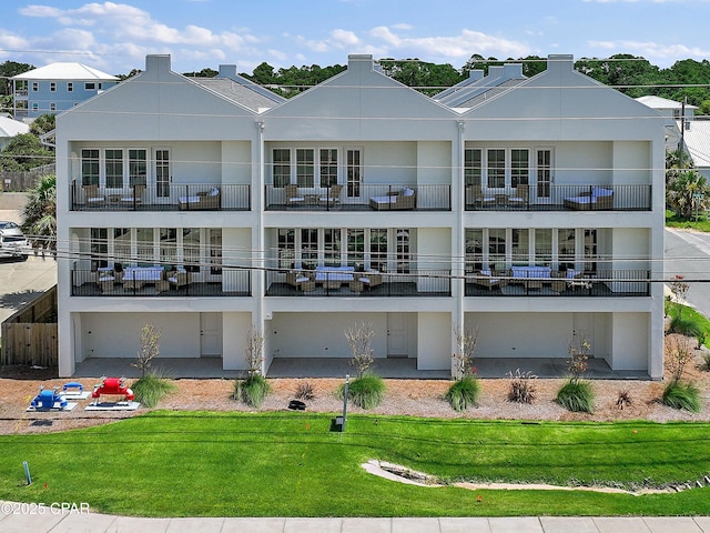 101 Deluna Pl Unit C, Panama City Beach, FL 32413 - back of house with a yard
