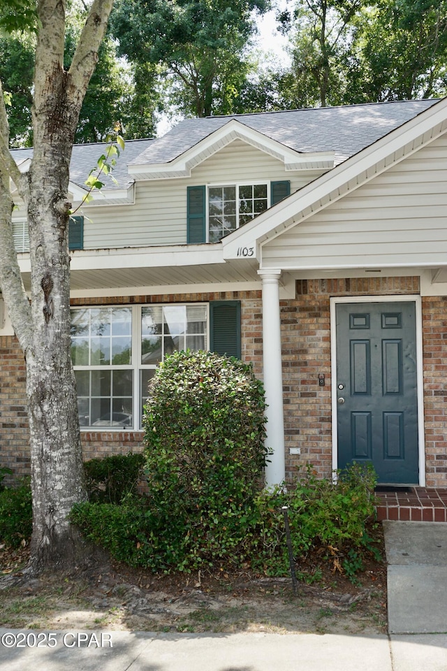 2738 W Tharpe St Unit 1103, Tallahassee, FL 32303 - entrance to property featuring brick siding and roof with shingles