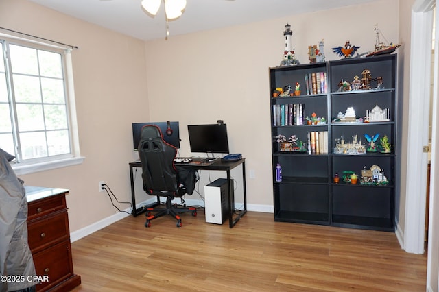 2738 W Tharpe St Unit 1103, Tallahassee, FL 32303 - home office featuring a ceiling fan, light wood finished floors, and baseboards
