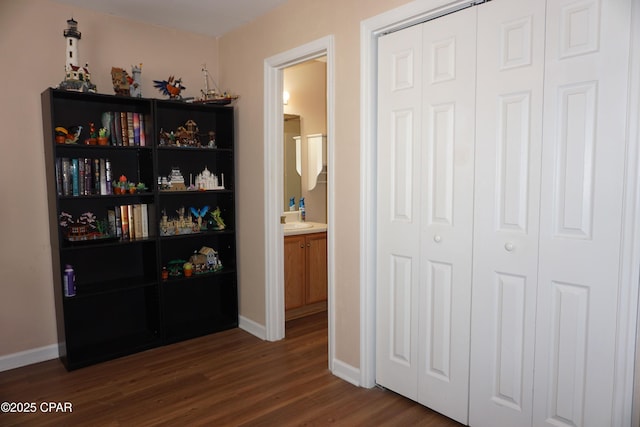 2738 W Tharpe St Unit 1103, Tallahassee, FL 32303 - interior space with dark wood-type flooring, baseboards, and a sink