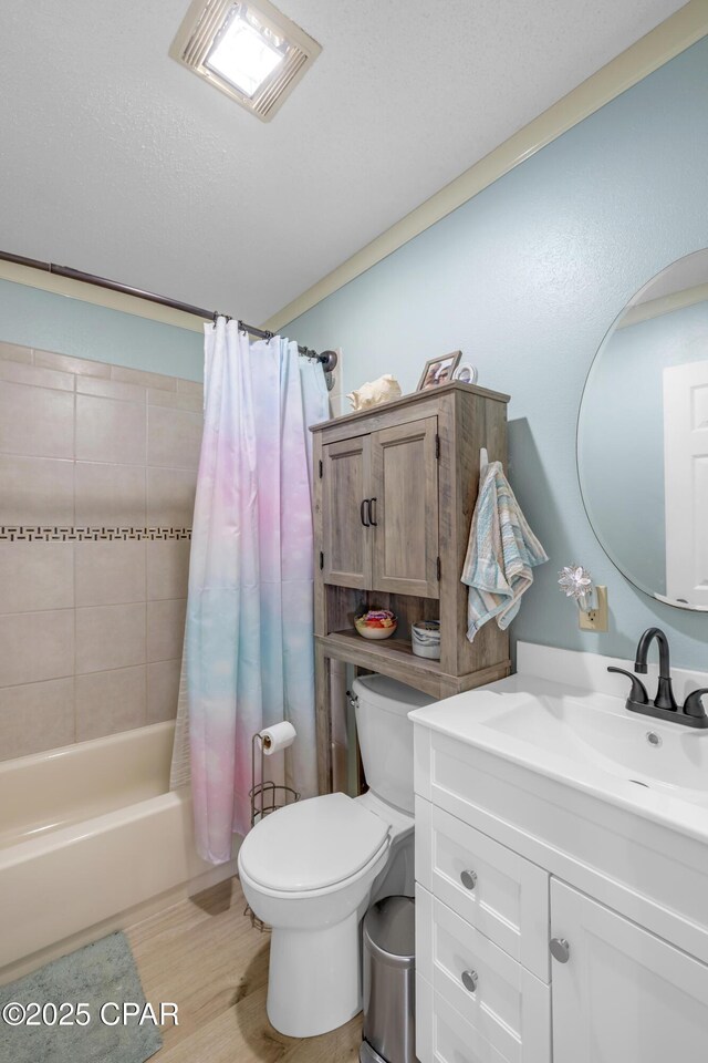 4331 Garrison Rd, Panama City, FL 32404 - full bath featuring toilet, vanity, shower / bathtub combination with curtain, and wood finished floors
