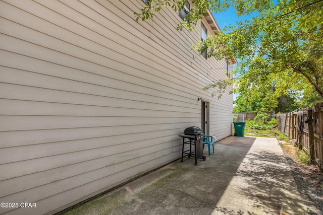 4331 Garrison Rd, Panama City, FL 32404 - view of side of home with a fenced backyard and a patio area