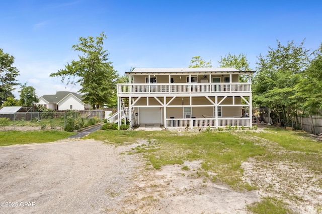 4331 Garrison Rd, Panama City, FL 32404 - back of property featuring dirt driveway and a garage