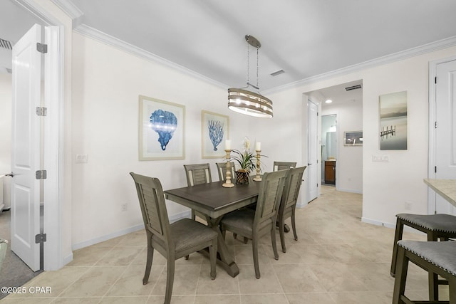 8636 Conch Shell Ct, Panama City Beach, FL 32413 - dining area featuring crown molding and light tile patterned flooring