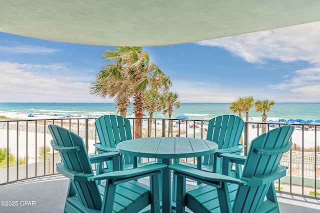 6201 Thomas Dr Unit 202, Panama City Beach, FL 32408 - balcony with view of water and beach and outdoor dining space