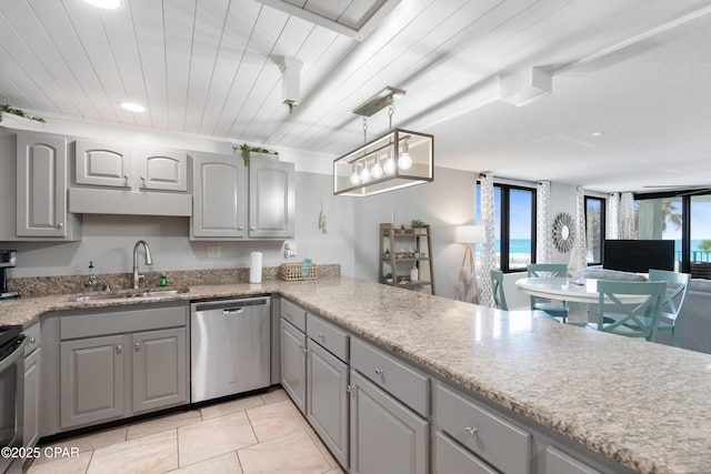 6201 Thomas Dr Unit 202, Panama City Beach, FL 32408 - kitchen with stainless steel appliances, gray cabinets, a sink, recessed lighting, and open floor plan
