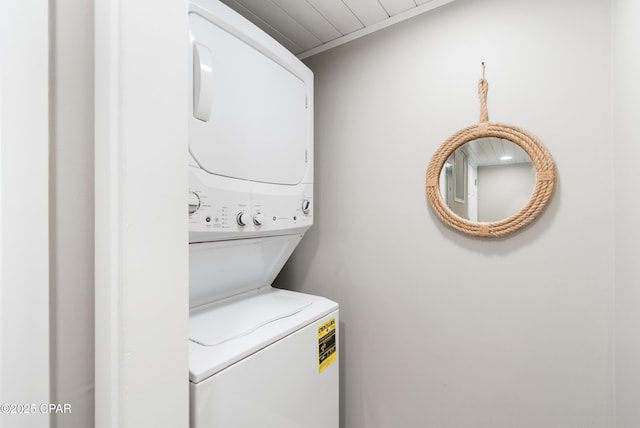 6201 Thomas Dr Unit 202, Panama City Beach, FL 32408 - laundry room with stacked washer / drying machine and crown molding