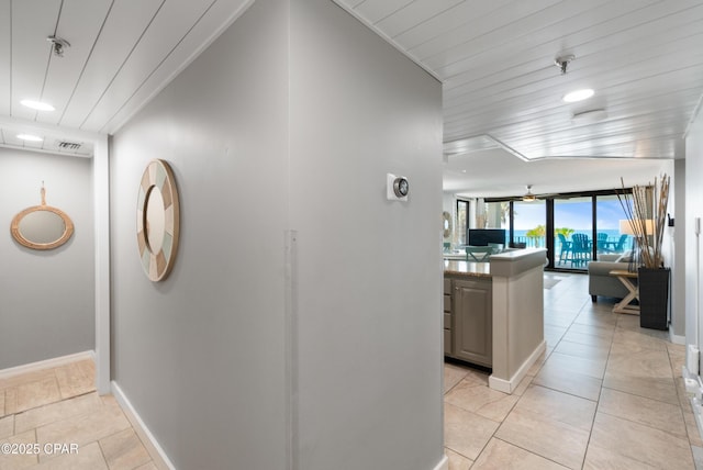 6201 Thomas Dr Unit 202, Panama City Beach, FL 32408 - hall featuring baseboards and light tile patterned flooring