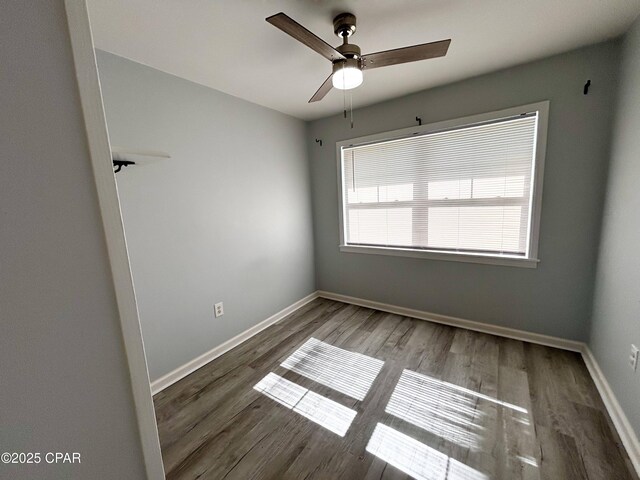 811 Mcgee Rd, Bonifay, FL 32425 - spare room featuring ceiling fan, wood finished floors, and baseboards
