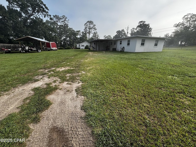 811 Mcgee Rd, Bonifay, FL 32425 - view of green lawn featuring dirt driveway