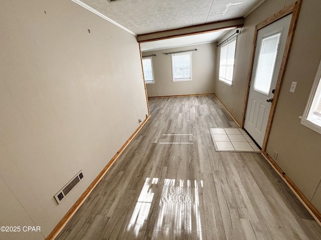 811 Mcgee Rd, Bonifay, FL 32425 - unfurnished room with light wood-style floors, baseboards, and crown molding