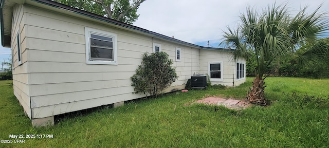 1006 N Church Ave, Panama City, FL 32401 - view of side of property with a lawn and cooling unit
