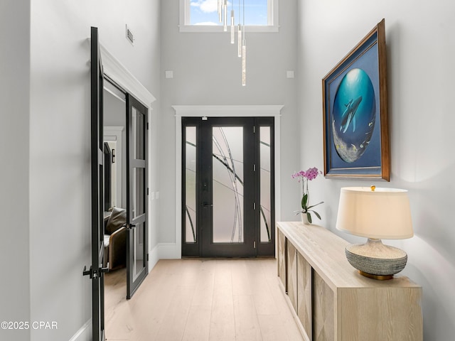 1507 Trout Ln, Panama City Beach, FL 32408 - foyer entrance with light wood-type flooring and baseboards