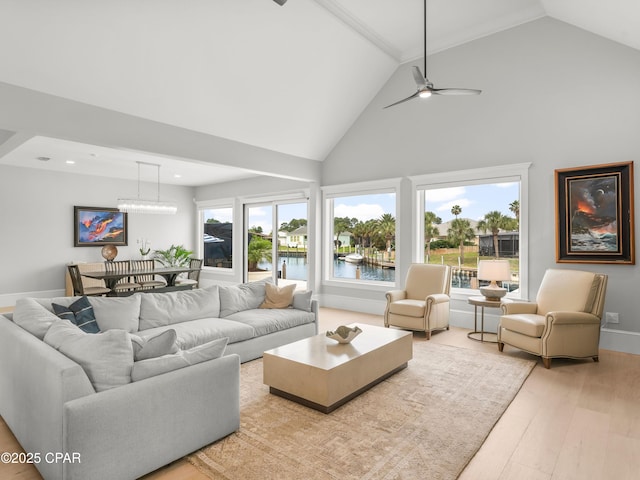 1507 Trout Ln, Panama City Beach, FL 32408 - living room featuring wood finished floors, a water view, high vaulted ceiling, recessed lighting, and a ceiling fan