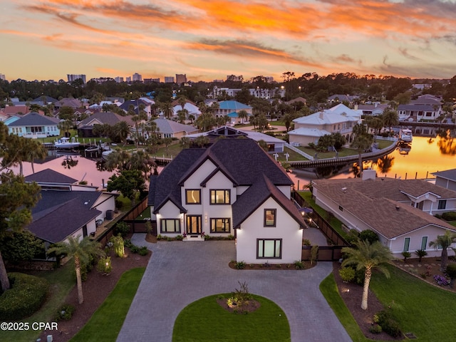 1507 Trout Ln, Panama City Beach, FL 32408 - aerial view at dusk of a residential view and a water view