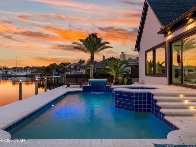 1507 Trout Ln, Panama City Beach, FL 32408 - view of swimming pool with a water view and a pool with connected hot tub