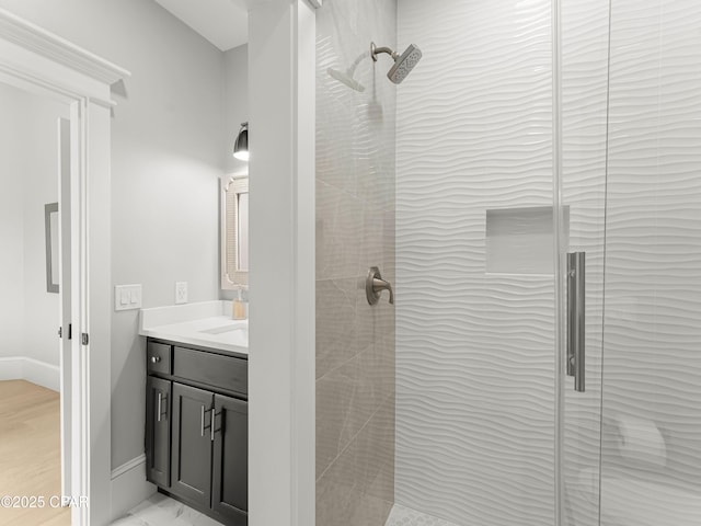 1507 Trout Ln, Panama City Beach, FL 32408 - bathroom with a stall shower, vanity, and baseboards