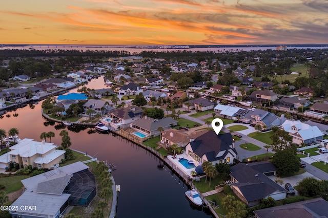 1507 Trout Ln, Panama City Beach, FL 32408 - aerial view at dusk of a water view and a residential view