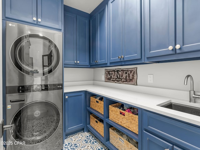 1507 Trout Ln, Panama City Beach, FL 32408 - washroom featuring stacked washer / drying machine, cabinet space, and tile patterned floors