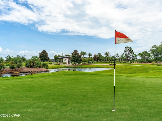 1507 Trout Ln, Panama City Beach, FL 32408 - view of community with a water view, view of golf course, and a lawn